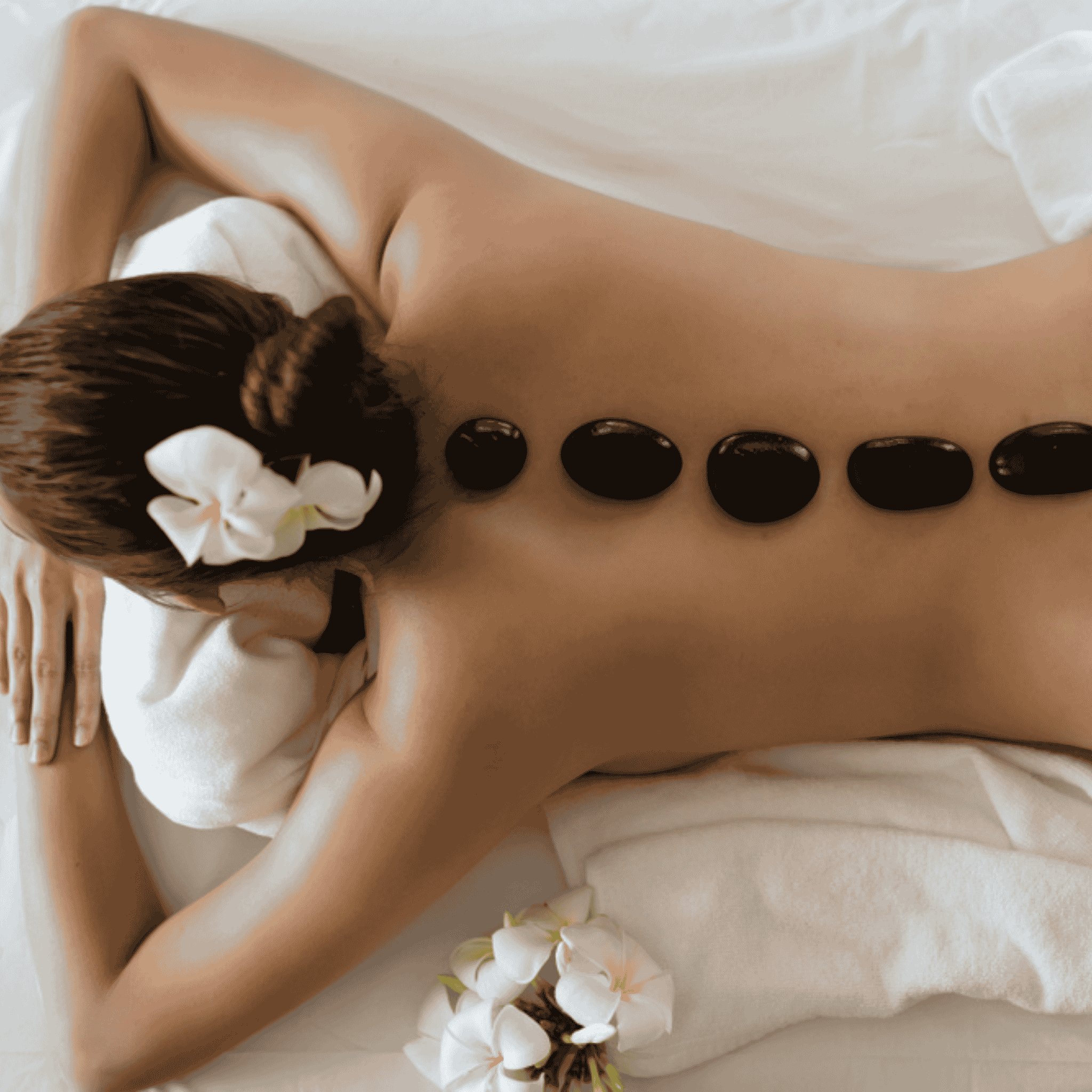 Hot stone massage training course for professional therapists using heated stones for deep relaxation treatments