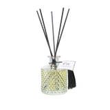 A beautiful bohemian reed diffuser filled with the scent of Orange Blossom