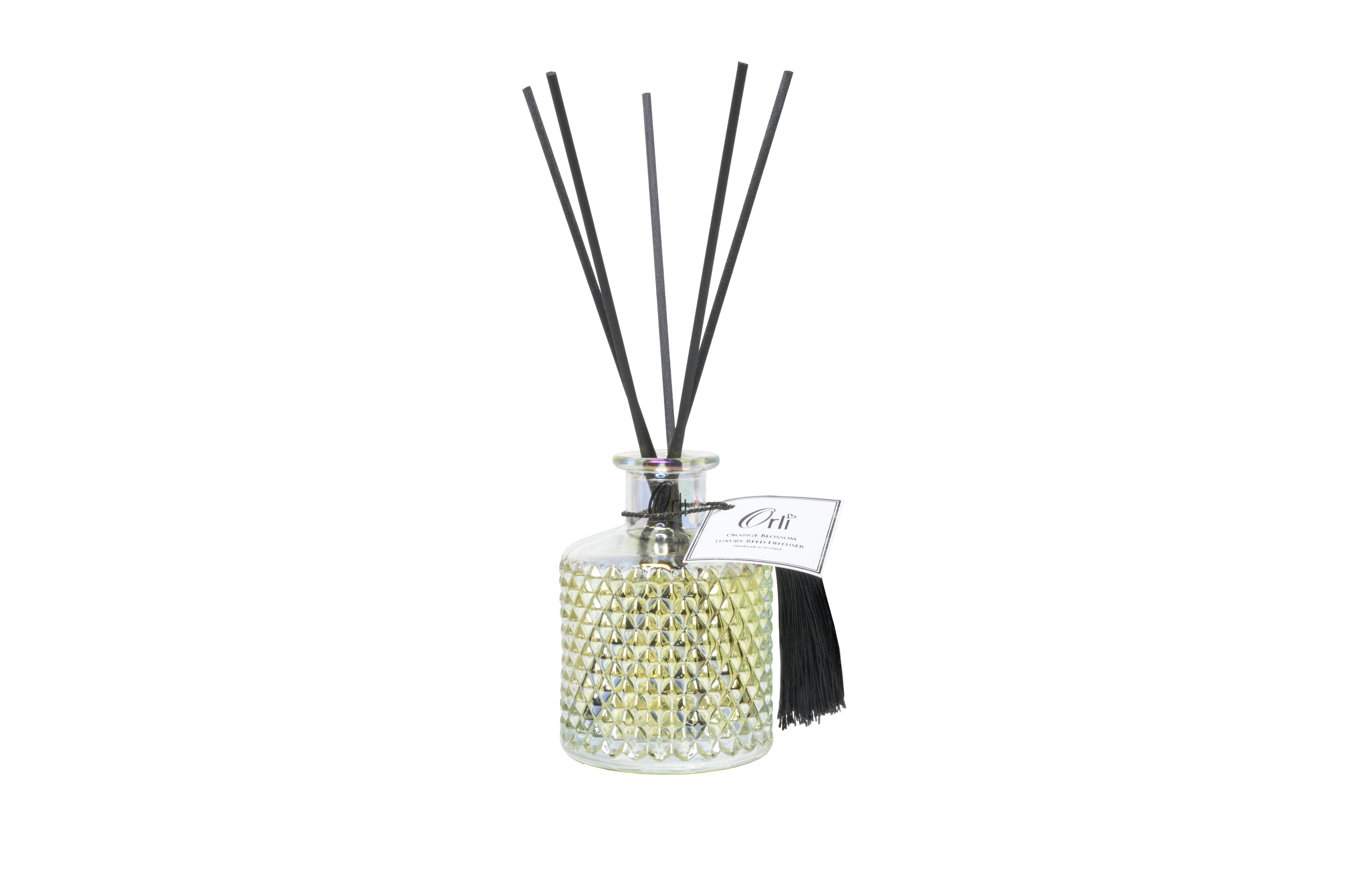 A beautiful bohemian reed diffuser filled with the scent of Orange Blossom